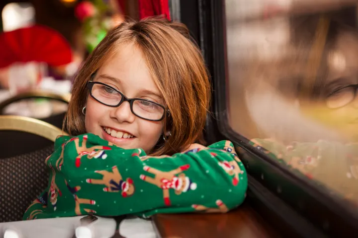 Child at window of train car