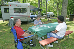 a group of people sitting at a park