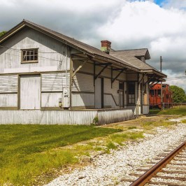 a train yard in front of a house
