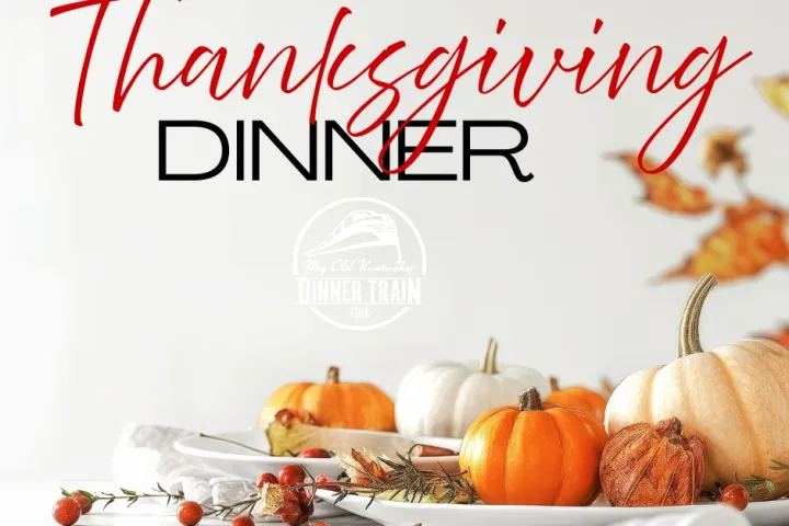 Thanksgiving Dinner text with pumpkins and autumn leaves on a white background.